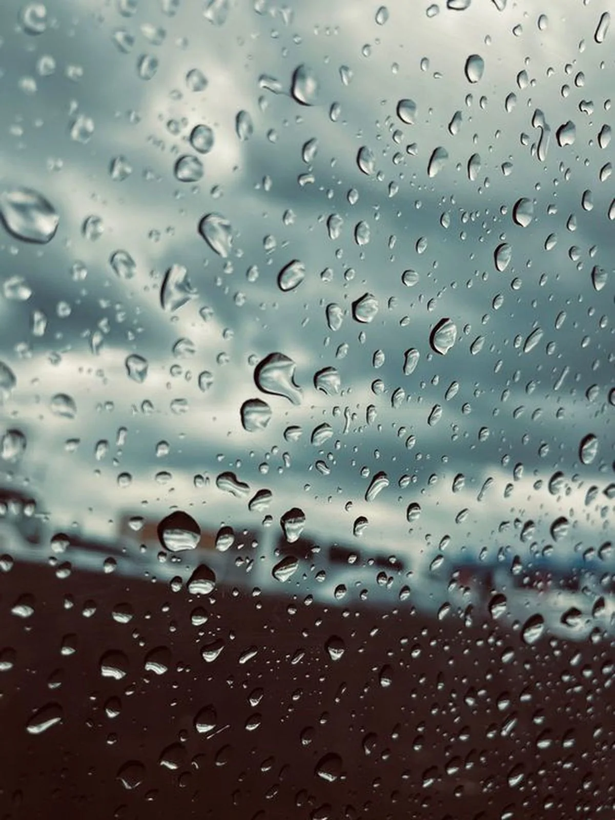 Clear rain droplets on a glass window